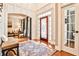 Elegant foyer with hardwood floors, a decorative rug, and intricate wall paneling with bench seating at 4537 Rutherford Dr, Marietta, GA 30062