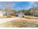 Charming single-story home featuring stone accents, neutral siding, a two-car garage, and a well-manicured lawn at 704 Stonecrest Ln, Loganville, GA 30052