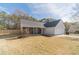 Charming single-story home featuring stone accents, neutral siding, a two-car garage, and a well-manicured lawn at 704 Stonecrest Ln, Loganville, GA 30052