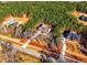 Aerial view of homes in a wooded neighborhood at 136 Rainey Rd, Temple, GA 30179