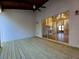 Covered back porch with a view of the living area through sliding glass doors at 136 Rainey Rd, Temple, GA 30179