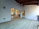 Covered back porch with a view of the living area through sliding glass doors at 136 Rainey Rd, Temple, GA 30179