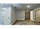 Neutral carpeted bedroom with attached ensuite bathroom, ceiling fan and natural light at 136 Rainey Rd, Temple, GA 30179