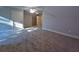 Spacious bedroom featuring neutral carpeting and an en suite bathroom at 136 Rainey Rd, Temple, GA 30179