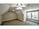 Bedroom with neutral carpeting, ceiling fan, and bright, natural light at 136 Rainey Rd, Temple, GA 30179