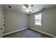 Bedroom featuring neutral walls, carpet, a window, and a ceiling fan at 136 Rainey Rd, Temple, GA 30179