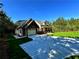 Exterior with attached garage, and a paved driveway lined by a freshly sodded lawn at 136 Rainey Rd, Temple, GA 30179