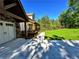 Exterior showcases a well-manicured lawn, covered porch, stone accents, and long concrete driveway at 136 Rainey Rd, Temple, GA 30179