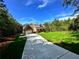 Beautifully landscaped front yard showcasing the home's exterior with an attached garage at 136 Rainey Rd, Temple, GA 30179