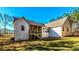 Picture of a home exterior featuring a deck, yard, trees and an abundance of natural sunlight at 136 Rainey Rd, Temple, GA 30179