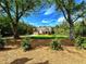 Charming two-story home with an attached garage and a beautifully landscaped front yard at 136 Rainey Rd, Temple, GA 30179