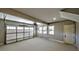 Spacious two car garage with a sealed floor, garage door, windows and a single entry door at 136 Rainey Rd, Temple, GA 30179