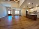 Bright open concept kitchen with a view to the living room, with hardwood floors at 136 Rainey Rd, Temple, GA 30179