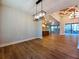 Open concept living room featuring hardwood floors, recessed lighting and modern light fixture at 136 Rainey Rd, Temple, GA 30179