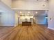 Bright open concept living room features hardwood floors and views to the kitchen at 136 Rainey Rd, Temple, GA 30179