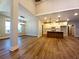 Open concept living room featuring hardwood floors, recessed lighting and views to kitchen at 136 Rainey Rd, Temple, GA 30179