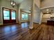 Spacious open concept living room featuring beautiful hardwood floors and natural light at 136 Rainey Rd, Temple, GA 30179
