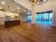 Open concept living room with sliding glass doors, recessed lighting, and hardwood floors at 136 Rainey Rd, Temple, GA 30179