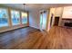 Bright living area with large windows, hardwood floors, and a view of the fireplace at 136 Rainey Rd, Temple, GA 30179