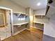 Walk-in closet featuring built-in shelving and wooden floors, providing ample storage space at 136 Rainey Rd, Temple, GA 30179