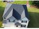 Aerial shot of a beautiful home showcasing its roof, backyard with lake access at 1861 Poplar Ave, Lithonia, GA 30058