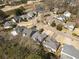 A high aerial view displays closely arranged homes in a suburban neighborhood surrounded by mature trees at 2000 Stethem Ferry Rd, Alpharetta, GA 30022