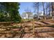 Spacious backyard with wooden fence and lush greenery creating a serene and private outdoor space at 2000 Stethem Ferry Rd, Johns Creek, GA 30022