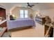 Bedroom featuring carpet, ceiling fan, a large bed, and plenty of light at 2000 Stethem Ferry Rd, Johns Creek, GA 30022