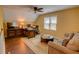 Bonus room offering flexible living space with wood floors, ceiling fan, and natural light at 2000 Stethem Ferry Rd, Johns Creek, GA 30022
