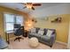Bonus room featuring a couch, desk, and ceiling fan at 2000 Stethem Ferry Rd, Johns Creek, GA 30022