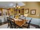 Combined kitchen and dining room with modern lighting and hardwood floors at 2000 Stethem Ferry Rd, Johns Creek, GA 30022