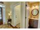 Inviting entryway with hardwood floors and a view of the powder room at 2000 Stethem Ferry Rd, Johns Creek, GA 30022