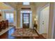 Inviting foyer with dark hardwood floors and a decorative area rug at 2000 Stethem Ferry Rd, Johns Creek, GA 30022