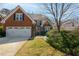 Attractive brick home with a well-manicured lawn, offering a welcoming and picturesque curb appeal at 2000 Stethem Ferry Rd, Johns Creek, GA 30022