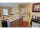 Upstairs hallway featuring hardwood floors, crown molding, and decorative accents at 2000 Stethem Ferry Rd, Alpharetta, GA 30022