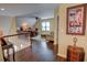 Upstairs hallway leads into a bonus living space with hardwood flooring and neutral decor at 2000 Stethem Ferry Rd, Johns Creek, GA 30022