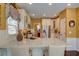 Modern kitchen island features granite countertops and bar stool seating at 2000 Stethem Ferry Rd, Johns Creek, GA 30022