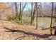 Scenic river view with a winding path surrounded by trees, providing a peaceful natural setting at 2000 Stethem Ferry Rd, Johns Creek, GA 30022