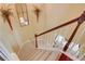 Carpeted staircase with white spindles and stained wood railing leads to the lower level at 2000 Stethem Ferry Rd, Johns Creek, GA 30022