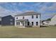 Large backyard and covered patio with a great view, perfect for entertaining and relaxation at 238 Arnewood Cir, Mcdonough, GA 30253