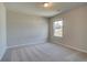 An empty bedroom featuring neutral walls and carpet, offering a blank canvas for personalization and comfort at 238 Arnewood Cir, Mcdonough, GA 30253