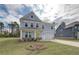Charming two-story home featuring a manicured lawn and a two-car garage at 238 Arnewood Cir, Mcdonough, GA 30253