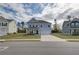 Charming two-story home featuring a manicured lawn, covered porch, and a two-car garage at 238 Arnewood Cir, Mcdonough, GA 30253