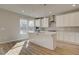 Modern kitchen featuring white cabinets, stainless steel appliances, and quartz countertops at 238 Arnewood Cir, Mcdonough, GA 30253