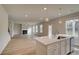 Bright open-concept kitchen next to a living area featuring an elegant design at 238 Arnewood Cir, Mcdonough, GA 30253