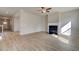 Spacious living room featuring a fireplace, neutral walls, and laminate flooring at 238 Arnewood Cir, Mcdonough, GA 30253