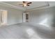 Main bedroom showcases a tray ceiling with fan, and doorway to bath, creating a relaxing retreat at 238 Arnewood Cir, Mcdonough, GA 30253