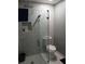Modern bathroom features walk-in shower with rainfall showerhead, marble tiled walls and floors at 2760 Waterford Park Dr, Lawrenceville, GA 30044