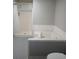Bathroom featuring a large tub and shower at 2760 Waterford Park Dr, Lawrenceville, GA 30044