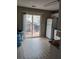 Kitchen area with stainless steel refrigerator and sliding door to outdoor porch at 2760 Waterford Park Dr, Lawrenceville, GA 30044
